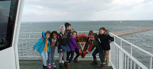 Smiling school children on Isle of Wight ferry